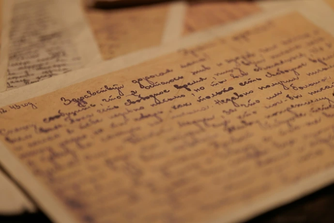 Handwritten notes on aged paper with blue ink